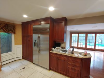 Precision Painting Plus residential house interior kitchen cabinet staining