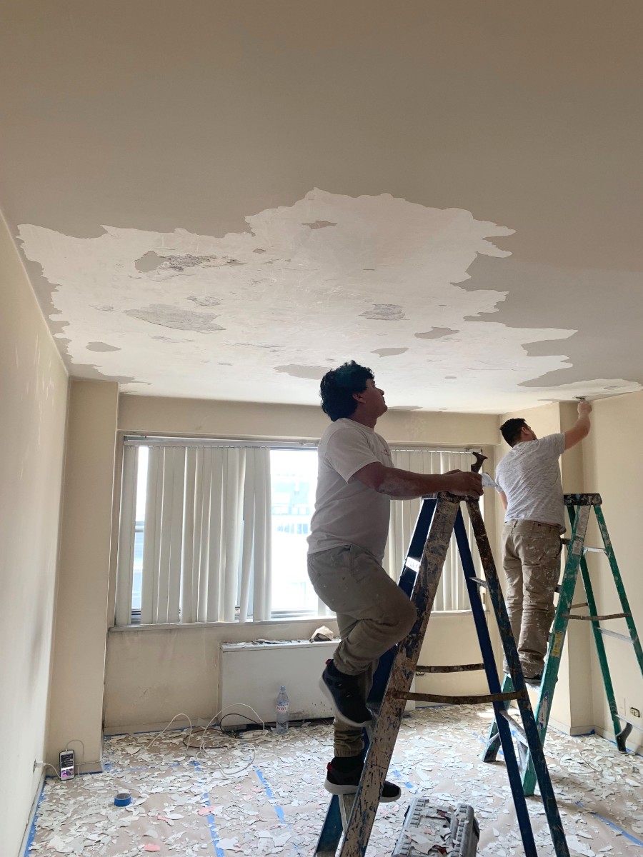 Precision Painting Plus residential apartment interior living room painting ceiling repair during