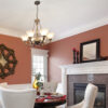 Dining room painted pink with white ceiling and trim.