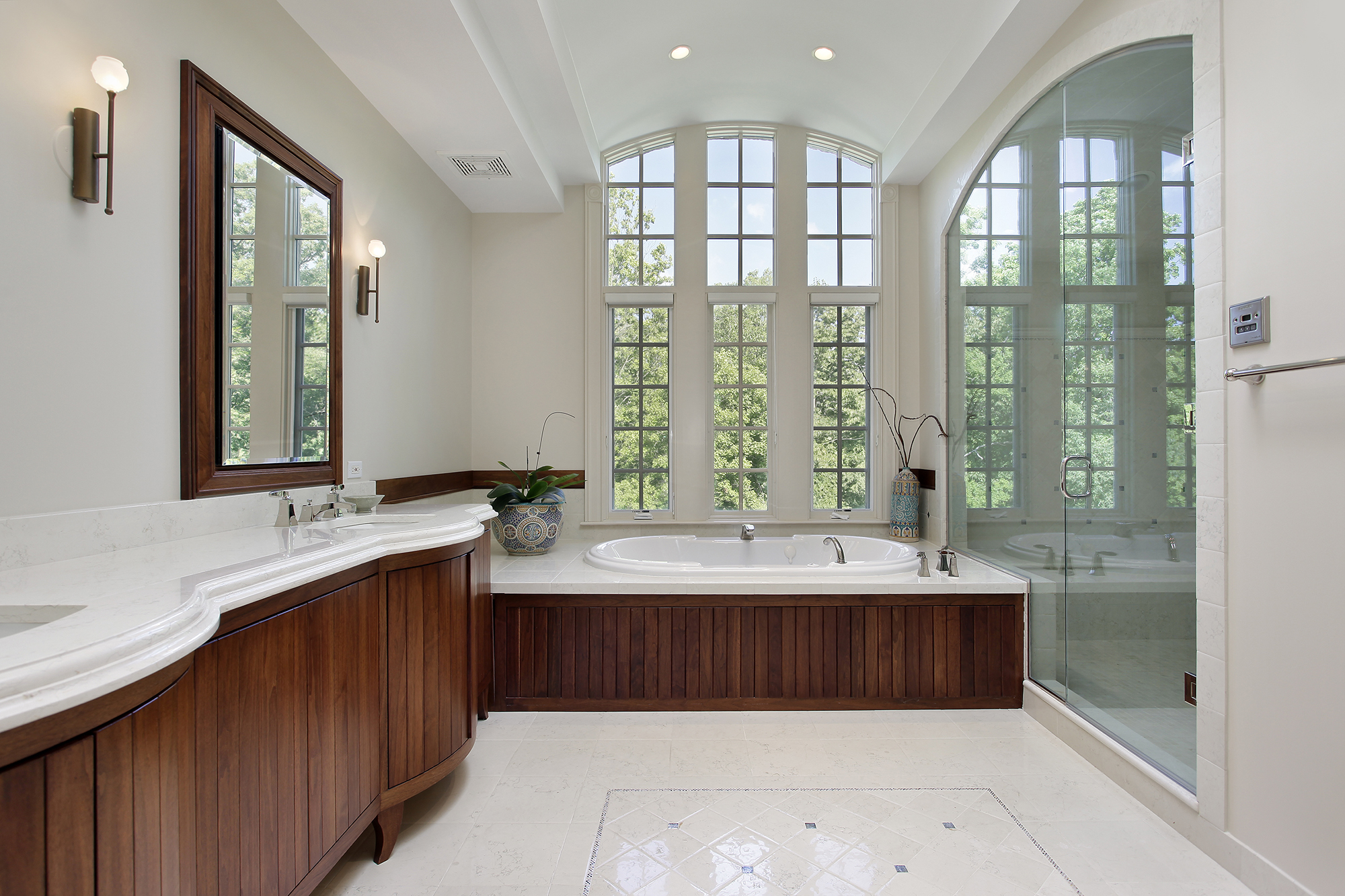 Luxury bathroom white painted walls and dark stained wood cabinets