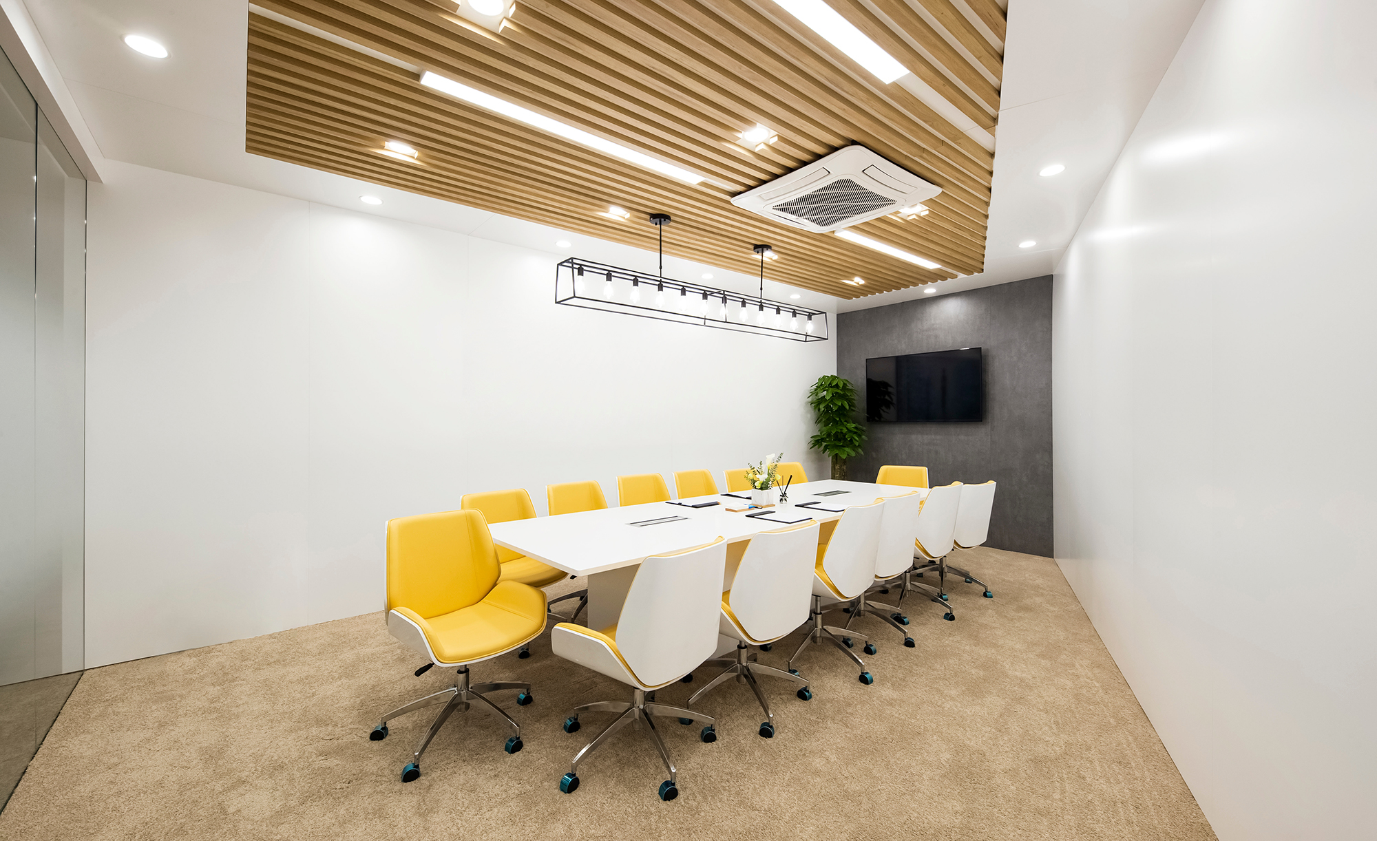 Office conference room with painted white walls and stained wood ceiling