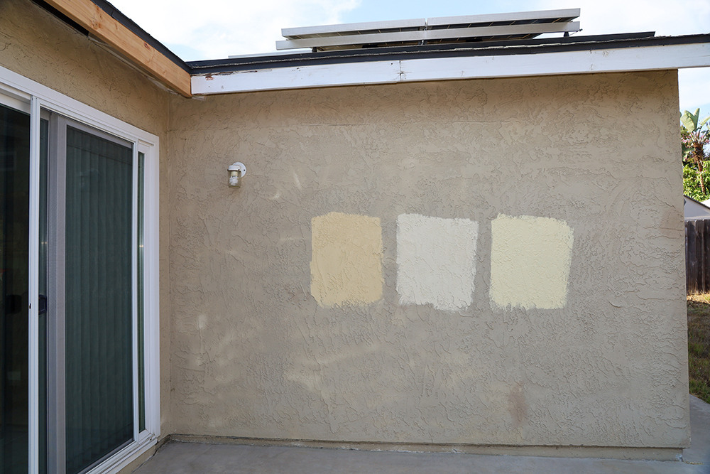 Paint samples on side of house choosing the right exterior paint color by comparison