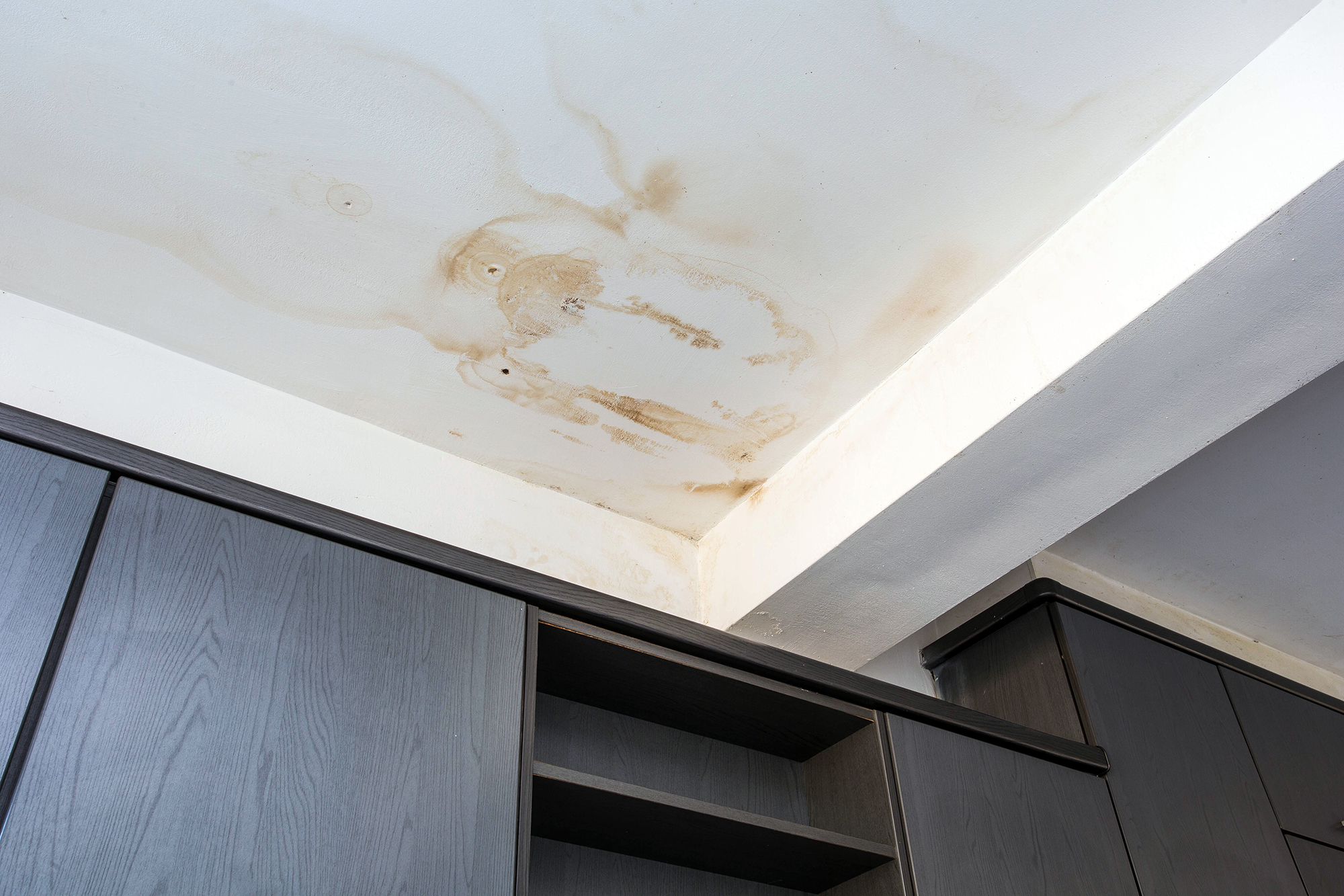 Water damaged ceiling and paint damaged due to water leaks