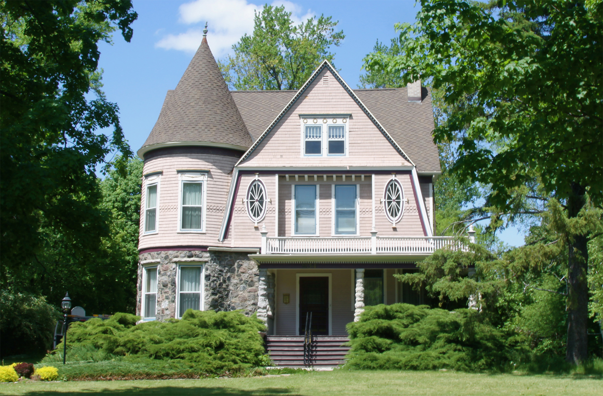 Old Victorian style house newly painted beige