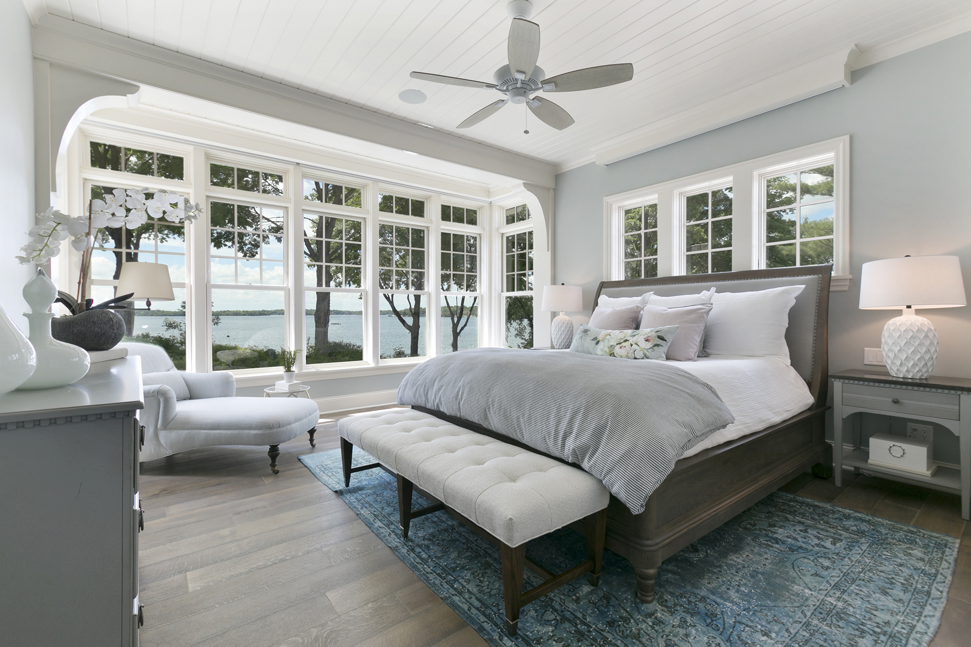 Luxury bedroom with gray blue painted walls and white trim