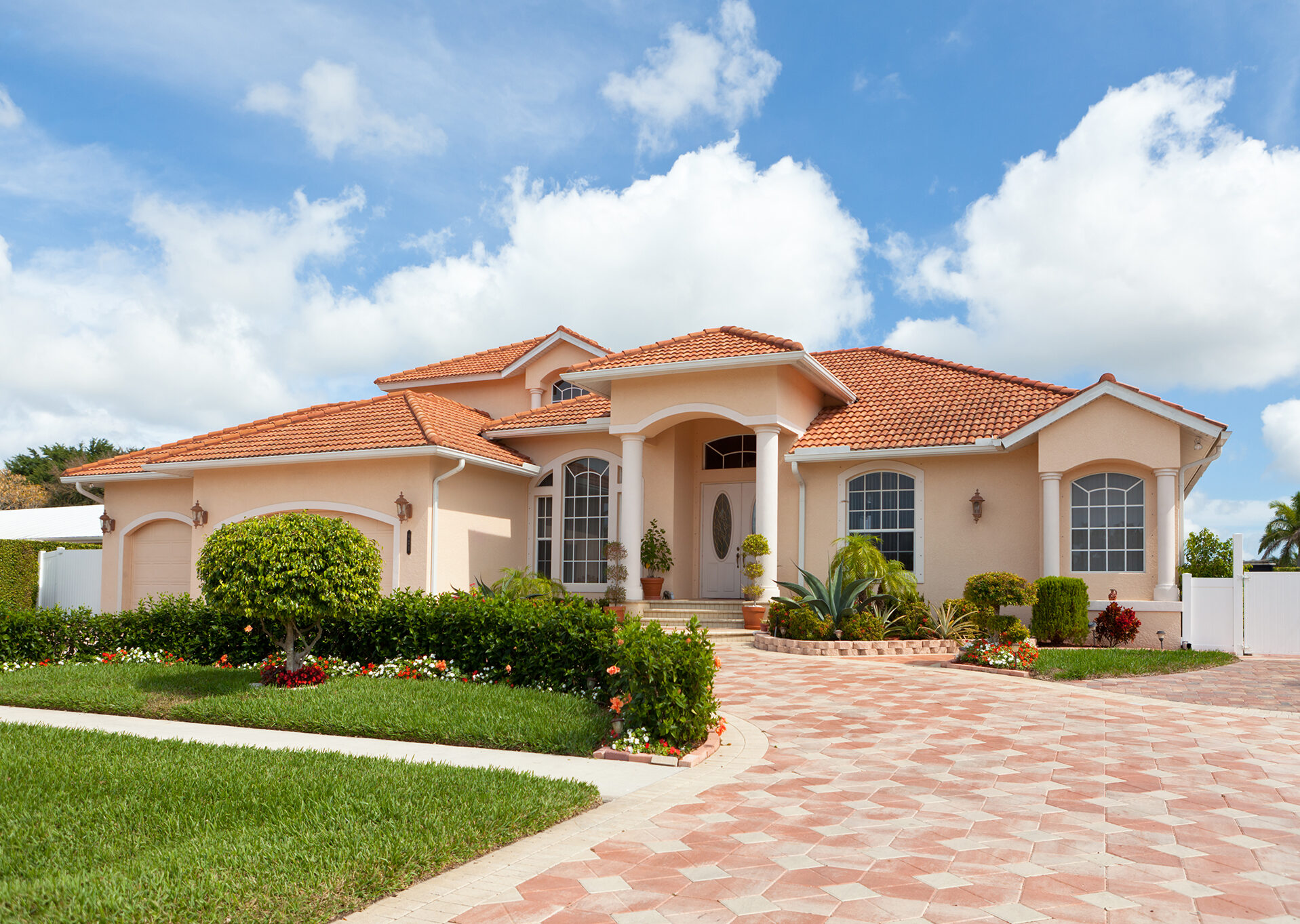 Stucco house with light orange painted exterior sides